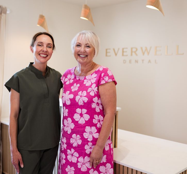 Dr Joanna Fraser with a smiling patient at Everwell Dental reception