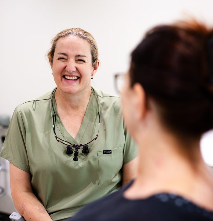 Everwell Dental hygienist chatting with a patient
